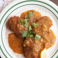 Crawfish Cakes · Topped with rich étouffée gravy.