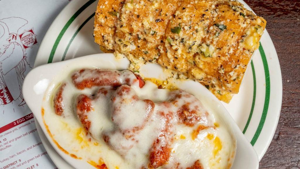 Chicken Parmesan · Panéed chicken over penne pasta topped with marinara & melted provolone, garlic bread.