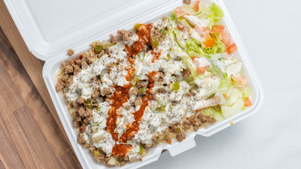 Lamb Over Rice · Grilled lamb over brown rice and salad topped with homemade taziki sauce (white sauce). white sauce is provided on the side. comes with 2 souffl� cup of white sauce and 1 souffl� cup of hot sauce.