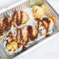 Rock N Roll · Tempura shrimp, Snow crab, avocado, top with masago and eel sauce.