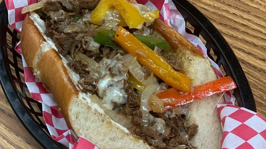 Philly Cheesesteak Sandwich · Served with chips.