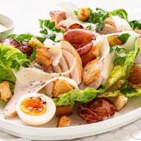 Smoked Chicken Caesar · Tuscan spring mix with a healthy helping of house-smoked chicken
