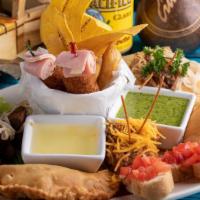 Tesoros Cubanos · Our most popular mix of Cuba. Fried pork chunks, croquetas, green plantain filled with ropa ...
