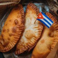 Beef Or Chicken Empanada · Golden fried to perfection stuffed with your choice of Cuban style beef or chicken.