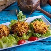Tostones Rellenos · A delightful combination of flavors. Six fried green plantains topped with your choice of ro...