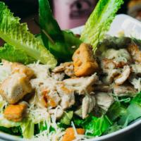Cuban Style Caesar Salad · A scrumptious Cuban version of the classic Caesar, topped with Parmesan cheese, grilled chic...