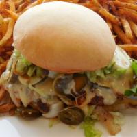 Pepper Jack Burger Hot · Hand-pattied beef pepper jack, grilled onions, jalapeno's, lettuce, and hot sauce on a tenne...