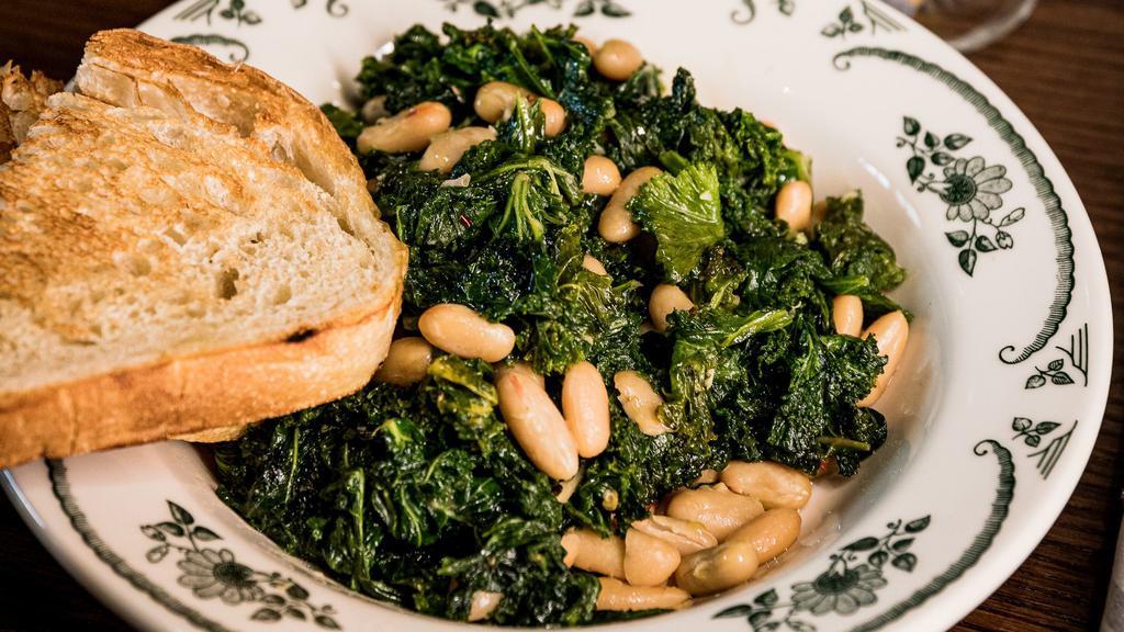 Beans And Greens · Local greens and Cannelini beans with toasted bread.
