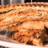 Eggplant Parm Sandwich · House breaded cutlet topped with San Marzano red sauce and Muenster on a crusty panini