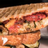 Zucchini Panini · Broiled ribbons of zucchini, goat cheese, chili oil and oven dried tomatoes pressed on ciaba...
