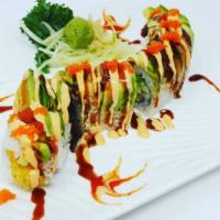 Dragon Roll · Shrimp tempura, cucumber inside 
with eel and avocado on the outside 
topped with masago.