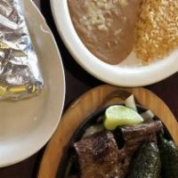 Carne Asada · Tender, thin sliced skirt steak. Served with grilled onions, jalapeño peppers, rice, beans a...