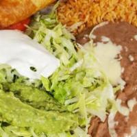 Taco Salad · Crispy flour shell filled with beans, lettuce, tomato, sour cream, guacamole and your choice...