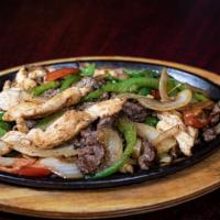 Pollo Poblano · Grilled chicken breast with sauteed onions, tomatoes, mushrooms and poblano peppers covered ...