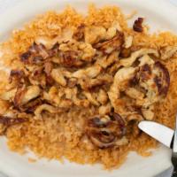 Pollo Gringo · Chichken breast over a bed of rice covered in cheese sauce.
