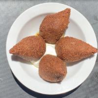 Kibbee Mikli · Fried dumplings of ground beef and lamb mixed with cracked wheat and onion, then stuffed wit...