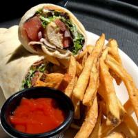 Chicken Kabob Wrap · Sitti’s famous chicken kabob with mixed greens, sumac onions, tomatoes and garlic whip.