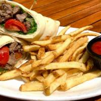 Beef & Lamb Shawarma Wrap · Marinated slices of beef and lamb with lettuce, diced tomatoes and tahini sauce.