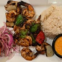 Shrimp Kabob · Grilled marinated blackened shrimp, sweet peppers, and onions served with mango salsa,
haris...