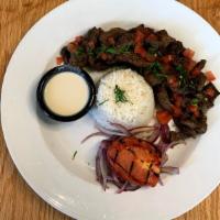 Beef & Lamb Shawarma · Thinly sliced marinated tender beef and lamb served with basmati rice, grilled tomato, sumac...