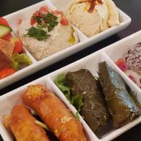 Vegetarian Tasting · Hummus, baba ghanouj, fattoush, cheese rolls, warak anab,
and falafel
