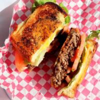 Frisco Burger · A juicy mound of beef between two slices of Parmesan grilled bread - 1 side with Swiss chees...