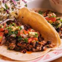2 Tacos · Your choice of 2 tacos on flour tortillas. Includes one side and garnished with slaw