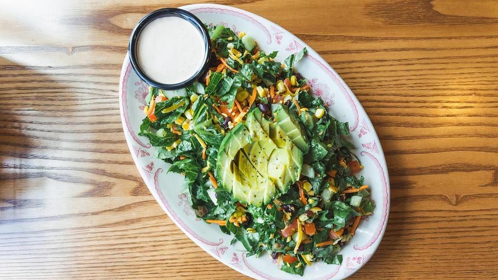 Chopped Salad - Large · Romaine, fire roasted corn, chopped tomatoes, black beans, avocado, carrots, cucumbers and shredded cheddar, tossed with your choice of dressing