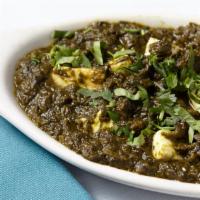Saag Paneer · Fresh spinach cooked with homemade cheee and spices.