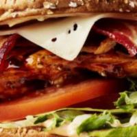 Big Whiskey'S Famous Chicken Sandwich · Grilled chicken breast, smoked bacon, lettuce, tomato and melted provolone cheese, topped wi...