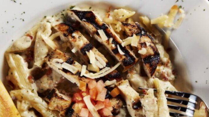Bacon Chicken Ranch Alfredo · Bacon chicken ranch alfredo our original alfredo sauce tossed with penne pasta and crisp diced bacon. Topped with sliced grilled chicken, fresh diced tomatoes, parmesan cheese. Served with garlic Texas toast.
