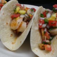 Shrimp Tacos · 3 healthy and mouth-watering grilled shrimp tacos with fresh pineapple pico de gallo. Served...