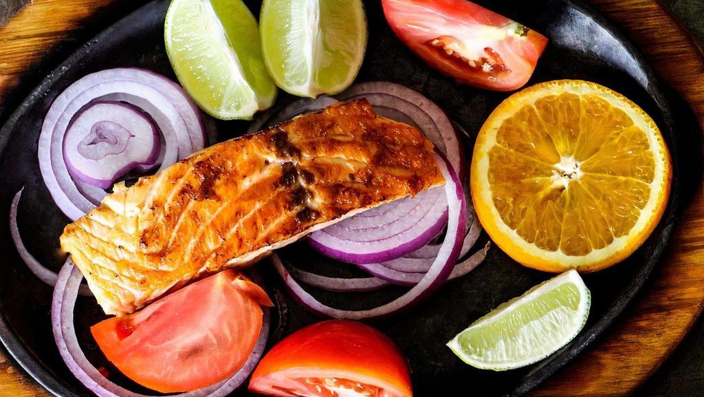 Salmon Fillet · A healthy choice! Lightly seasoned and grilled served over onions, accompanied with rice, lettuce, tomatoes and fresh pineapple pico de gallo.