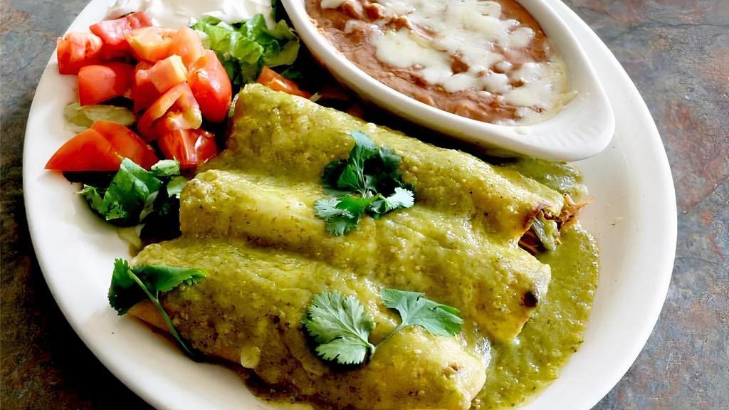 Enchiladas Verdes · 3 chicken or beef enchiladas topped with green tomatillo sauce and cheese. Side of lettuce, sour cream and served with beans.