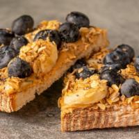 House Toast · Sourdough, peanut butter, banana, blueberries, chia seeds, granola.