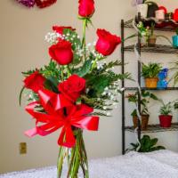 Half Dozen Red Roses · Half dozen red roses in a clear vase with red bow