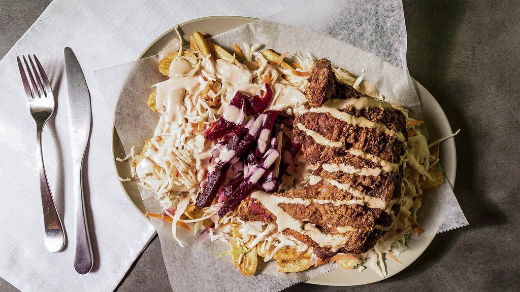 Pollo Con Tajadas · Fried Chicken, accompanied with green plantain, cabbage, special cream of the house and the special and secret ingredient of the house.