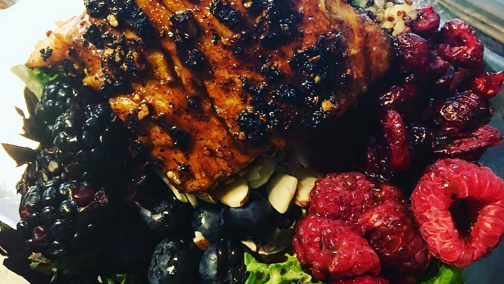 Salmon Power Bowl · Maple smokehouse rubbed Atlantic salmon, blueberries, blackberries, raspberries, sliced almonds, dried cranberries and quinoa over spring mix topped with a maple balsamic vinaigrette.