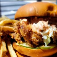 The Dasher Chicken Sandwich · Buttermilk Fried Chicken, Cole Slaw, House-Made Pickles, Dash Sauce, Challah Bun.