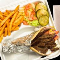 Gyro Pita · Half lb. of tender seasoned ground lamb/beef blend wrapped in a toasted pita with our home-m...