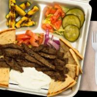 Open-Face Gyro Platter · Lamb/beef blend over salad with pita chips and two sides.