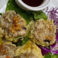 Thai Dumpling (4 Pcs.) · Ground pork and shrimp mixed with chopped water chestnuts, mushrooms, bamboo, and garlic  se...