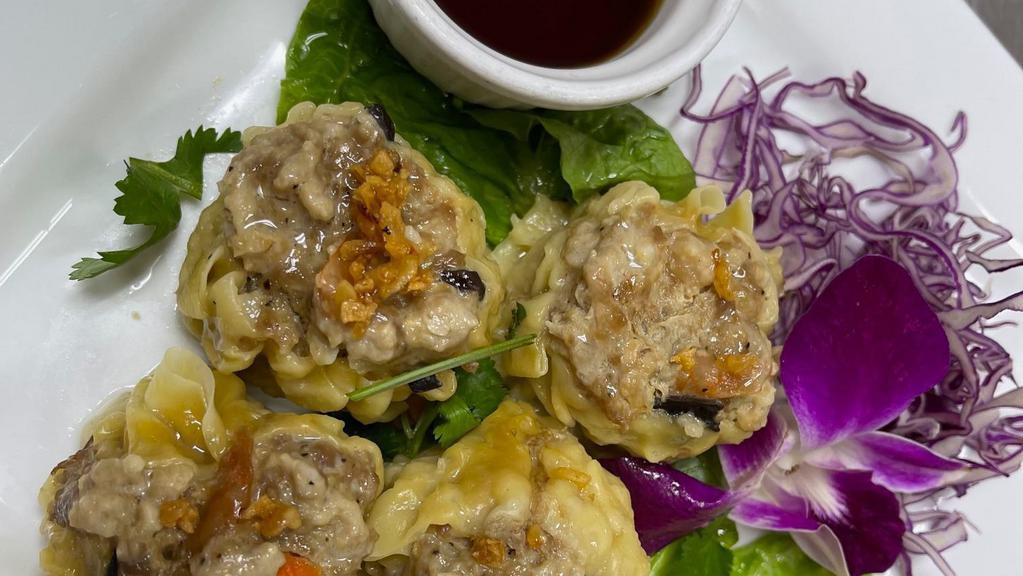 Thai Dumpling (4 Pcs.) · Ground pork and shrimp mixed with chopped water chestnuts, mushrooms, bamboo, and garlic  served with chef’s special sauce.