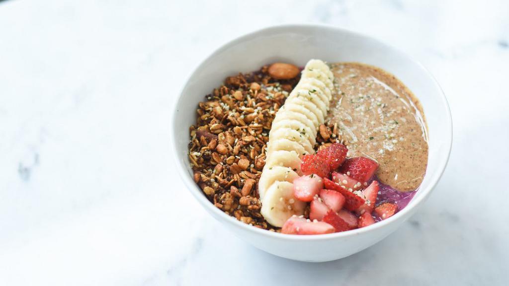Pro · Oat milk, dragon fruit, blueberries, strawberries, kale, avocado, spinach, dates, vanilla extract. Topped with granola, banana, strawberries, almond butter, hemp seeds.