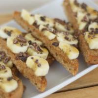 Almond Banana · Sourdough bread, almond butter, banana, cacao nibs, chocolate syrup.