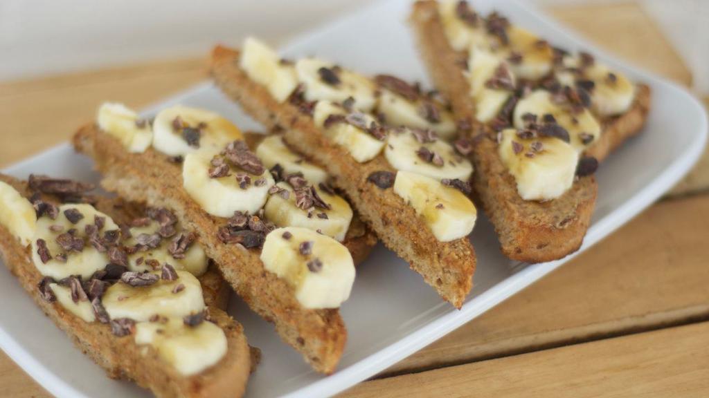 Almond Banana · Sourdough bread, almond butter, banana, cacao nibs, chocolate syrup.