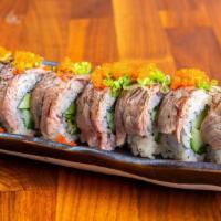 Surf & Turf · Shrimp tempura and jalapeño tempura, cucumber, chives topped with seared beef, soy ginger vi...