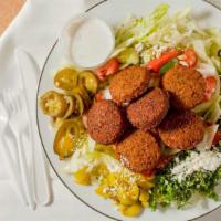 Falafel Plate · 5 piece of falafel over rice comes with salad and pita bread