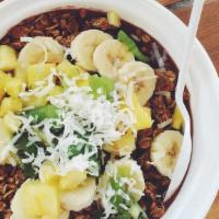 Haole Bowl · Blended acai, banana and honey. Topped with granola banana, kiwi, pineapple and coconut.