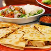 Quesadilla Supreme · Two layers of quesadilla cut into triangles  filled with cheese, steak and chicken, cooked w...